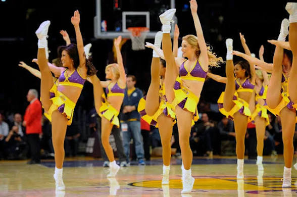 LA Lakers dancers performing high kicks on court